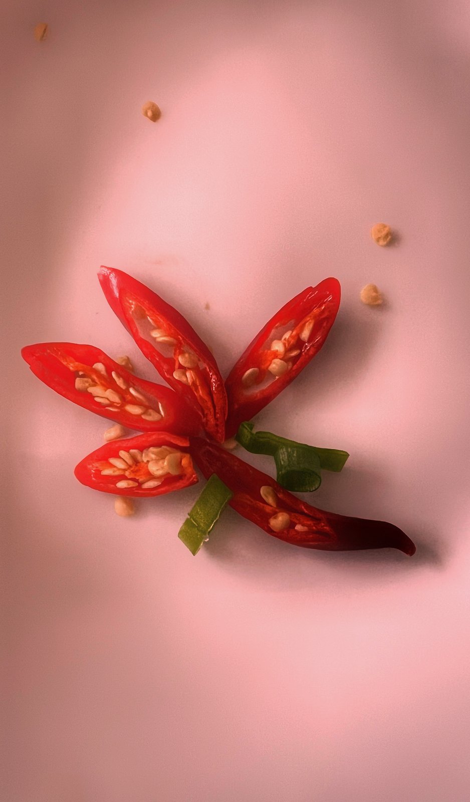 Red chili, sliced — a flower of heat
