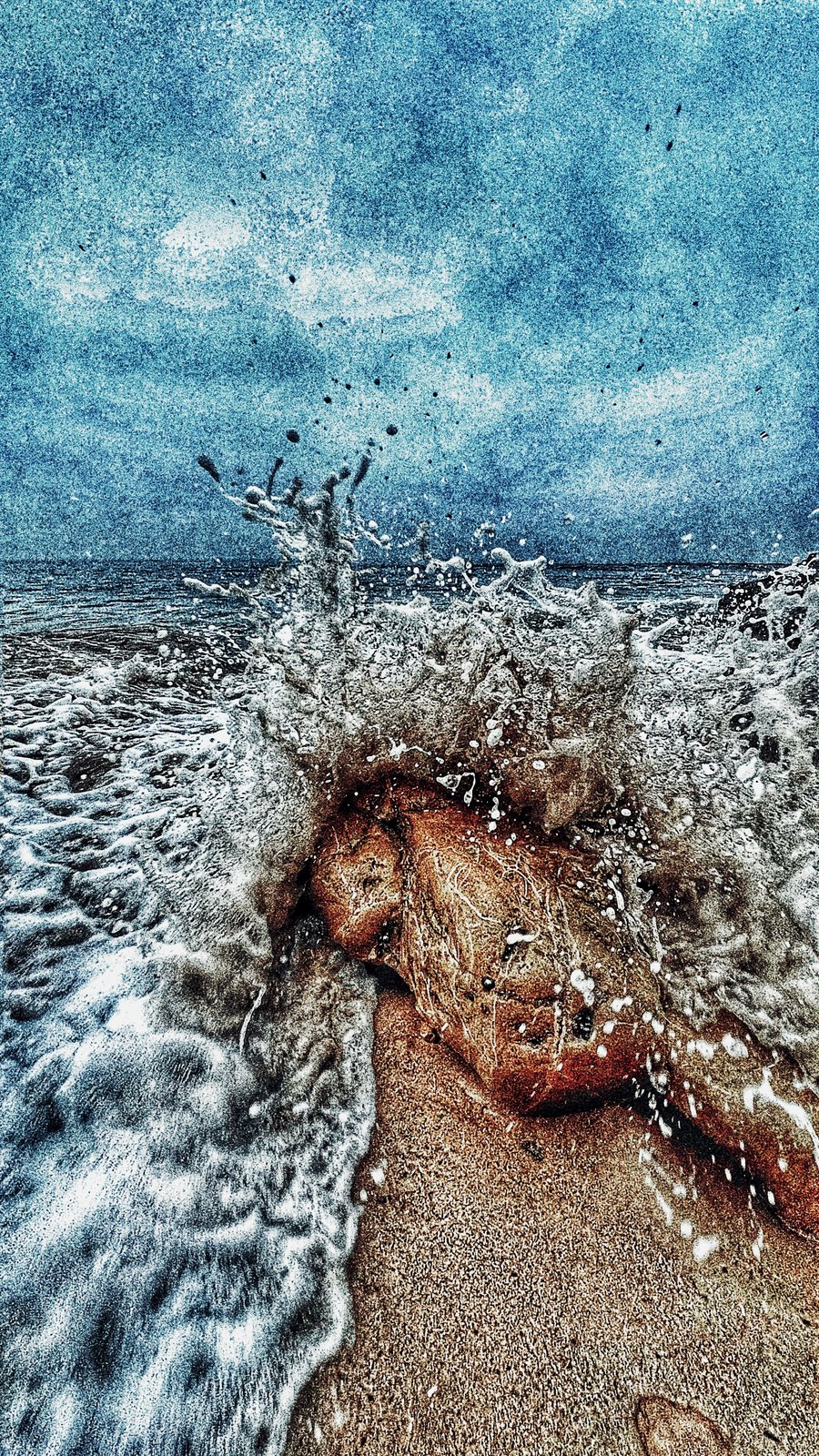 Wave breaking over stone