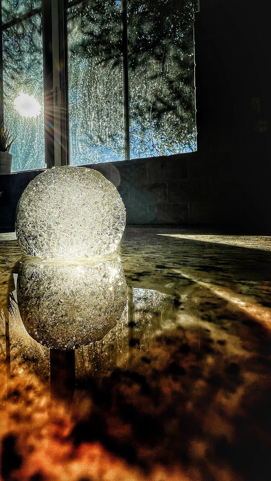 Ice orb in window light